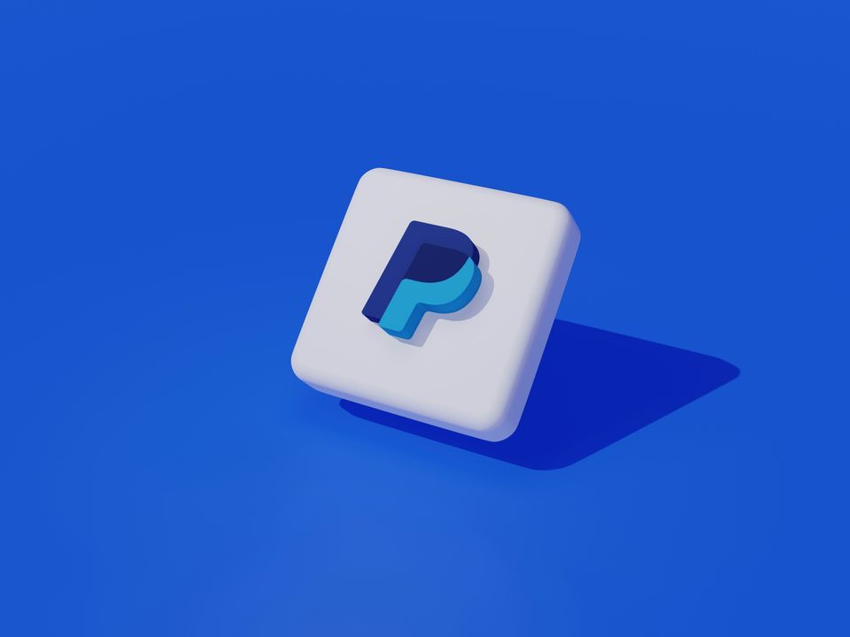 Three-dimensional PayPal app icon on a blue background