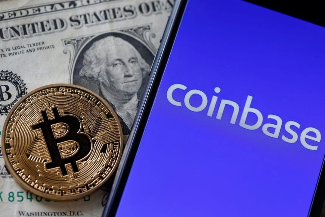 A Bitcoin coin on a US dollar bill beside a phone showing the Coinbase logo