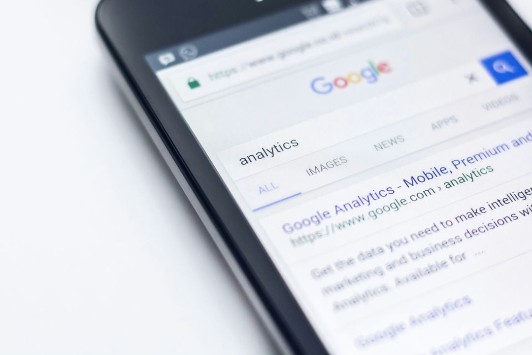 Phone showing Google search results for the query analytics